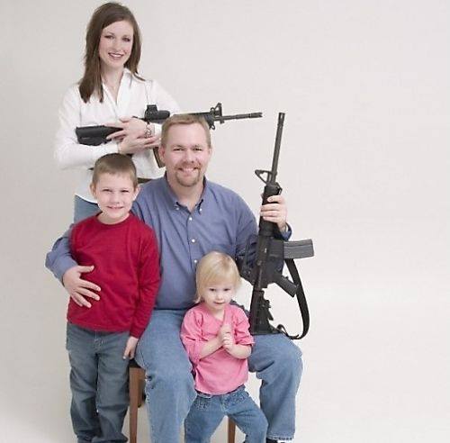 You've got to hand it to them. Most people who take pictures with their kids and automatic rifles don't look nearly this wholesome. Maybe it helps that the kids aren't holding the guns.